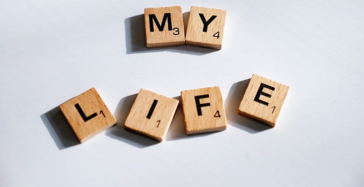 scrabbled wooden blocks spelling the word my life