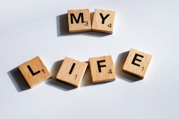 scrabbled wooden blocks spelling the word my life