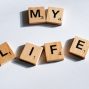 scrabbled wooden blocks spelling the word my life